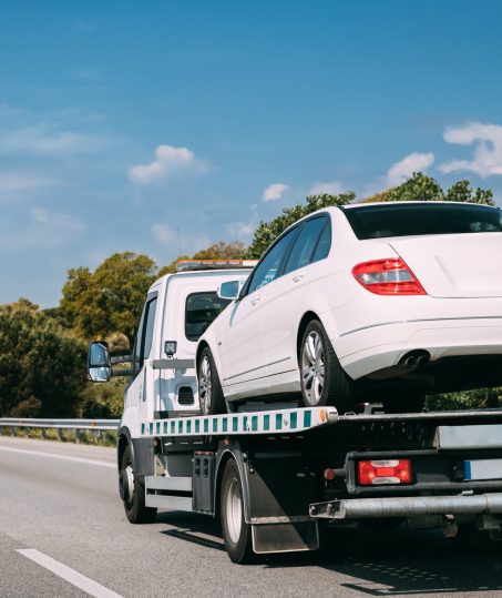 Car,Service,Transportation,Concept.,Tow,Truck,Transporting,Car,On,Motorway
